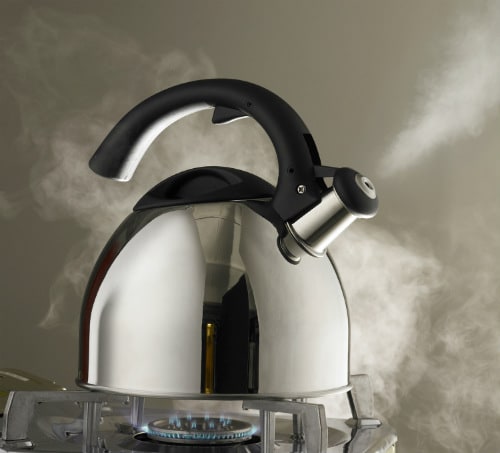 A kettle boiling on a stove, potentially creating kettle limescale