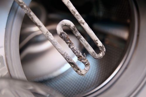how to remove hard water buildup from washing machine